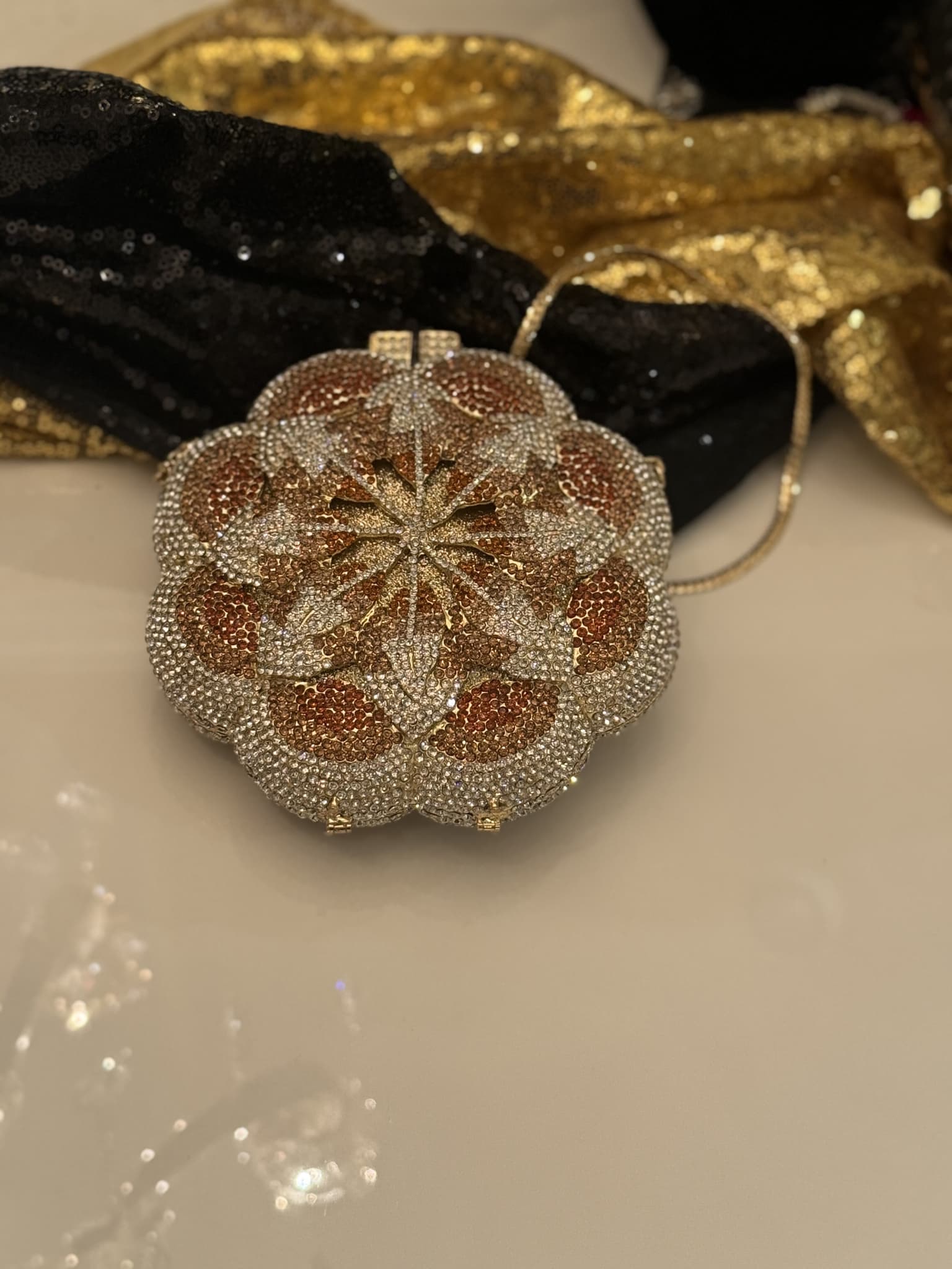 gold-rhinestone-floral-round-clutch