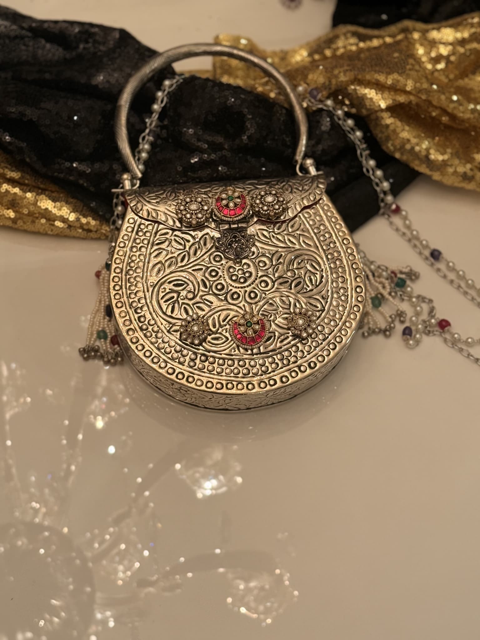 silver-floral-embossed-handle-clutch