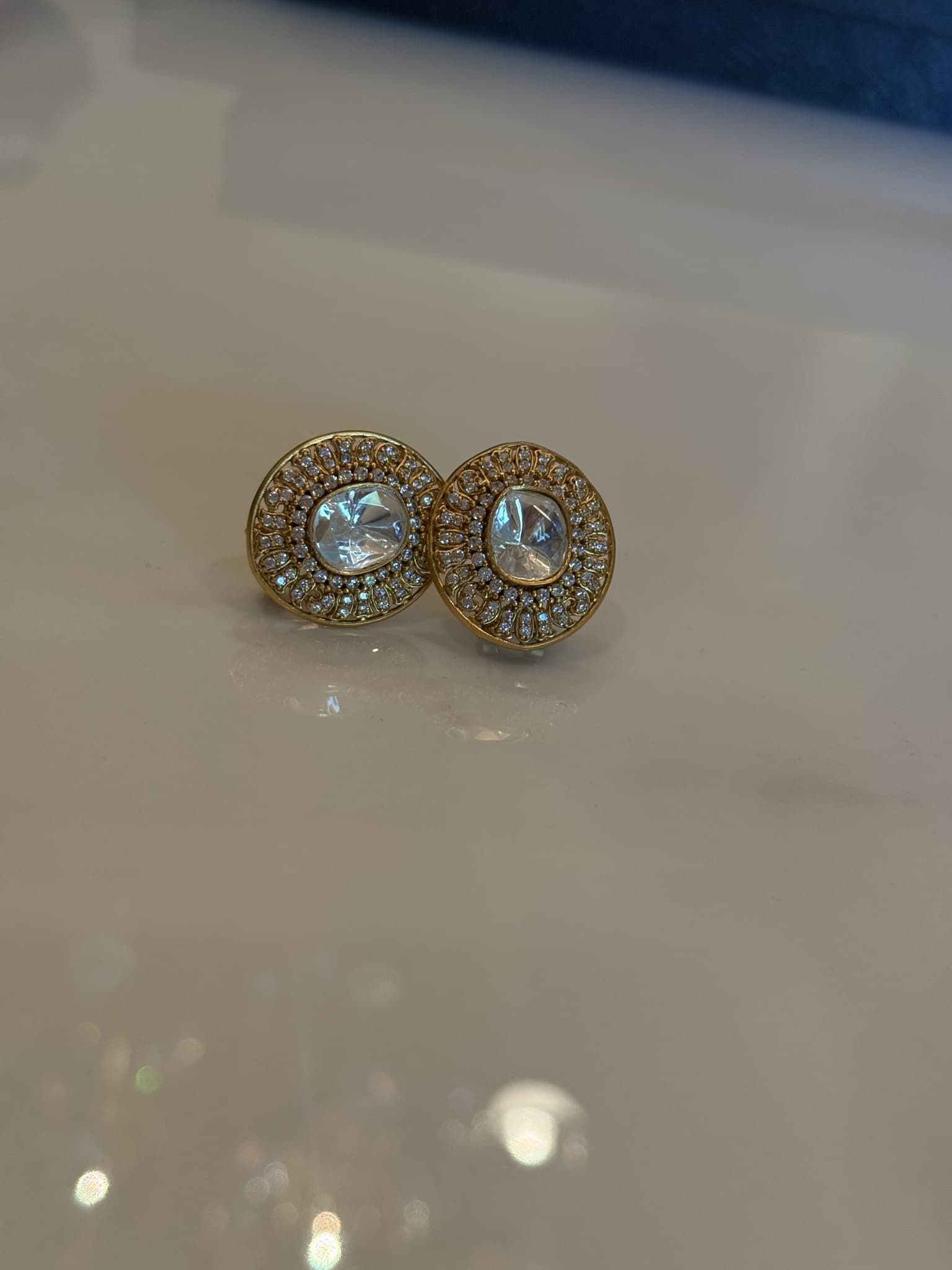 Golden Oval Stud Earrings with White Stones