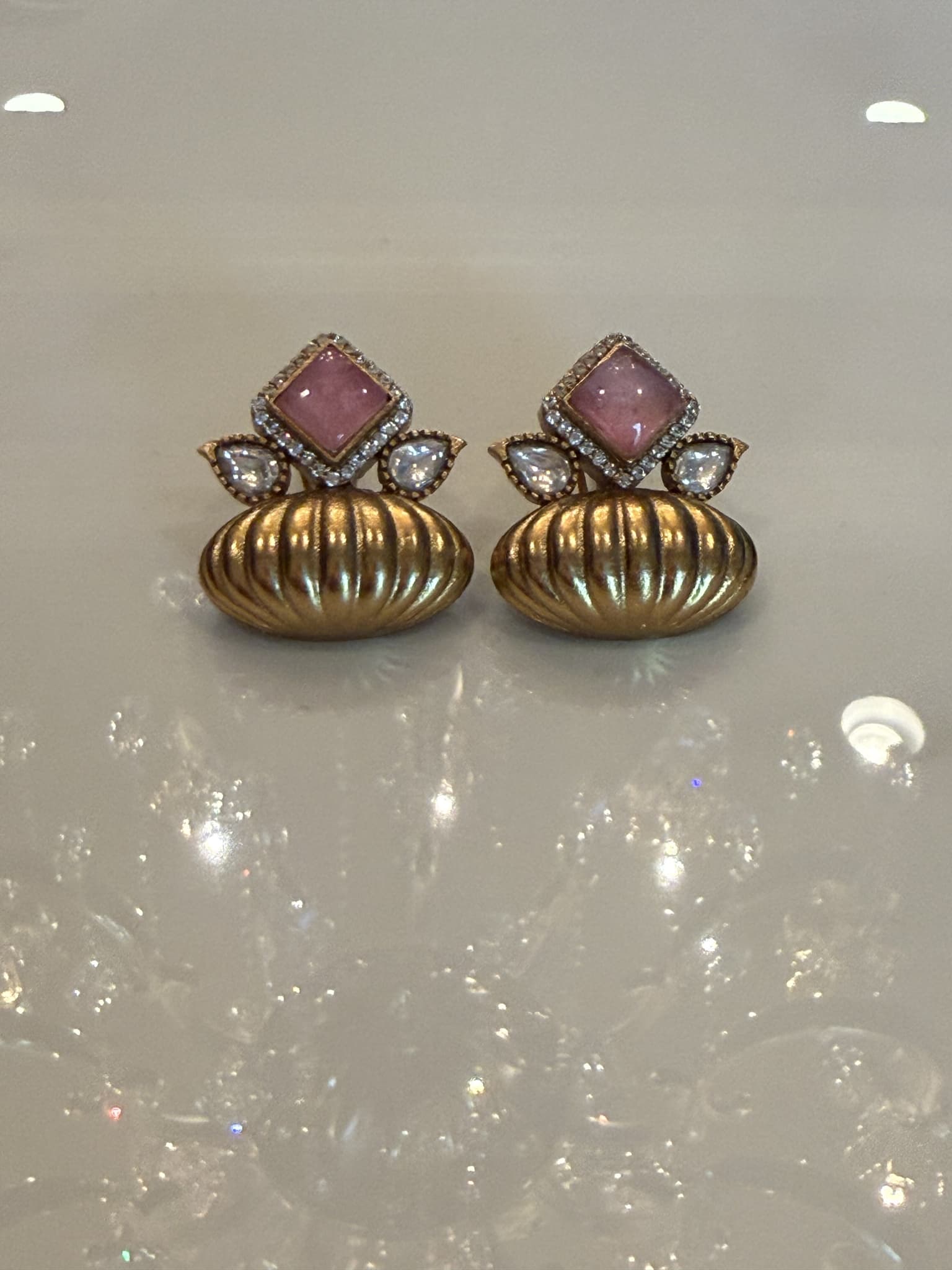 Golden Oval Stud Earrings with White Stones