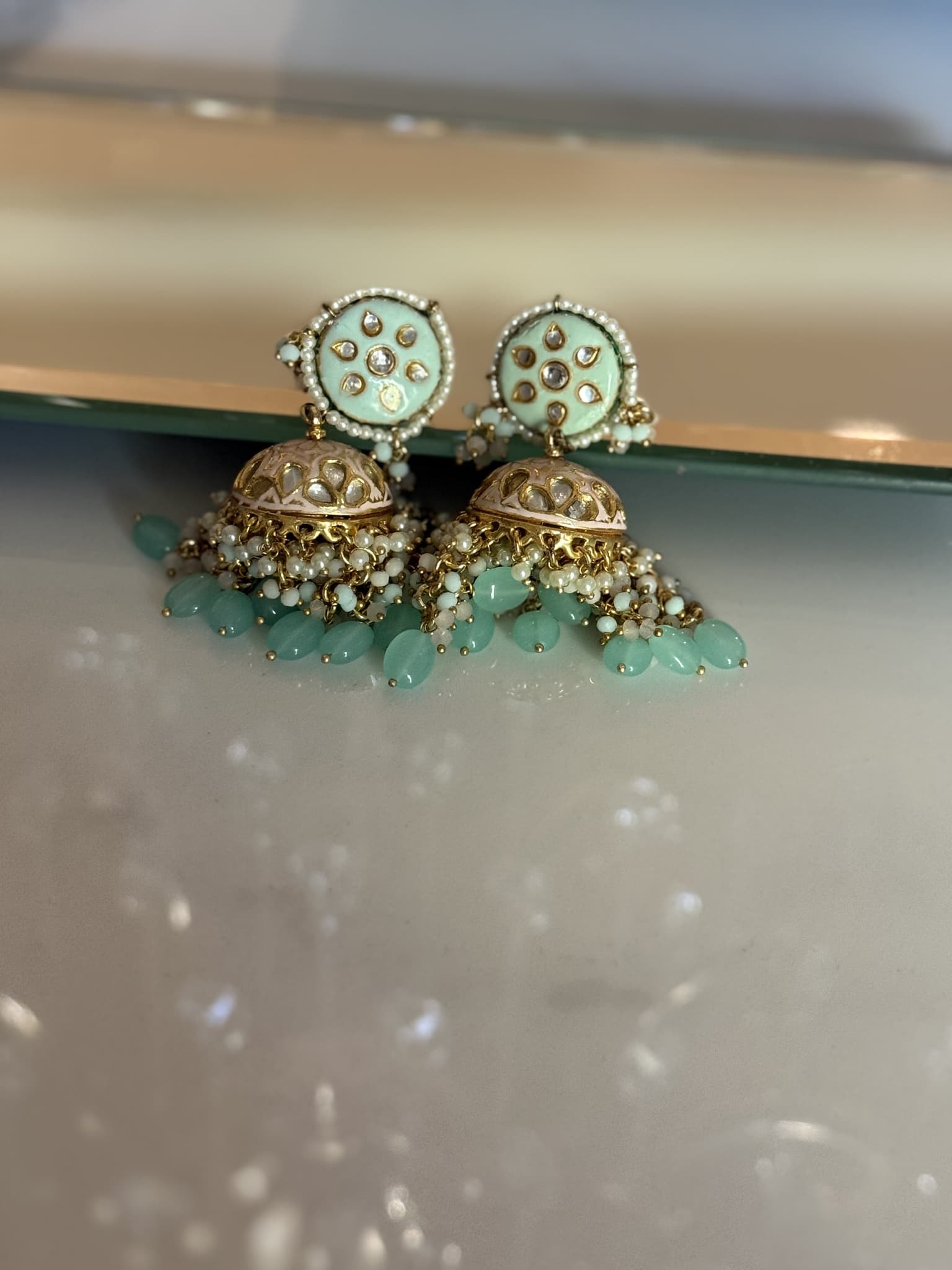 Pastel Green Pearl Tassel Jhumka Earrings
